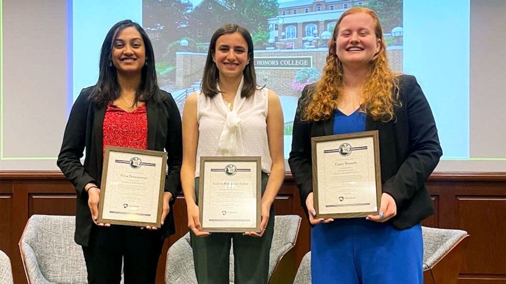 Priya Devanarayan, Luisina Kemanian-Leites, and Casey Sennett receiving thesis awards